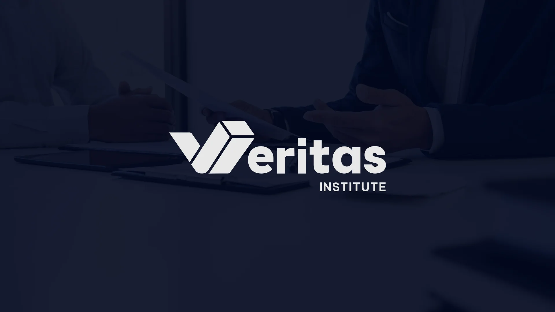Veritas Institute wordmark over a professional boardroom setting